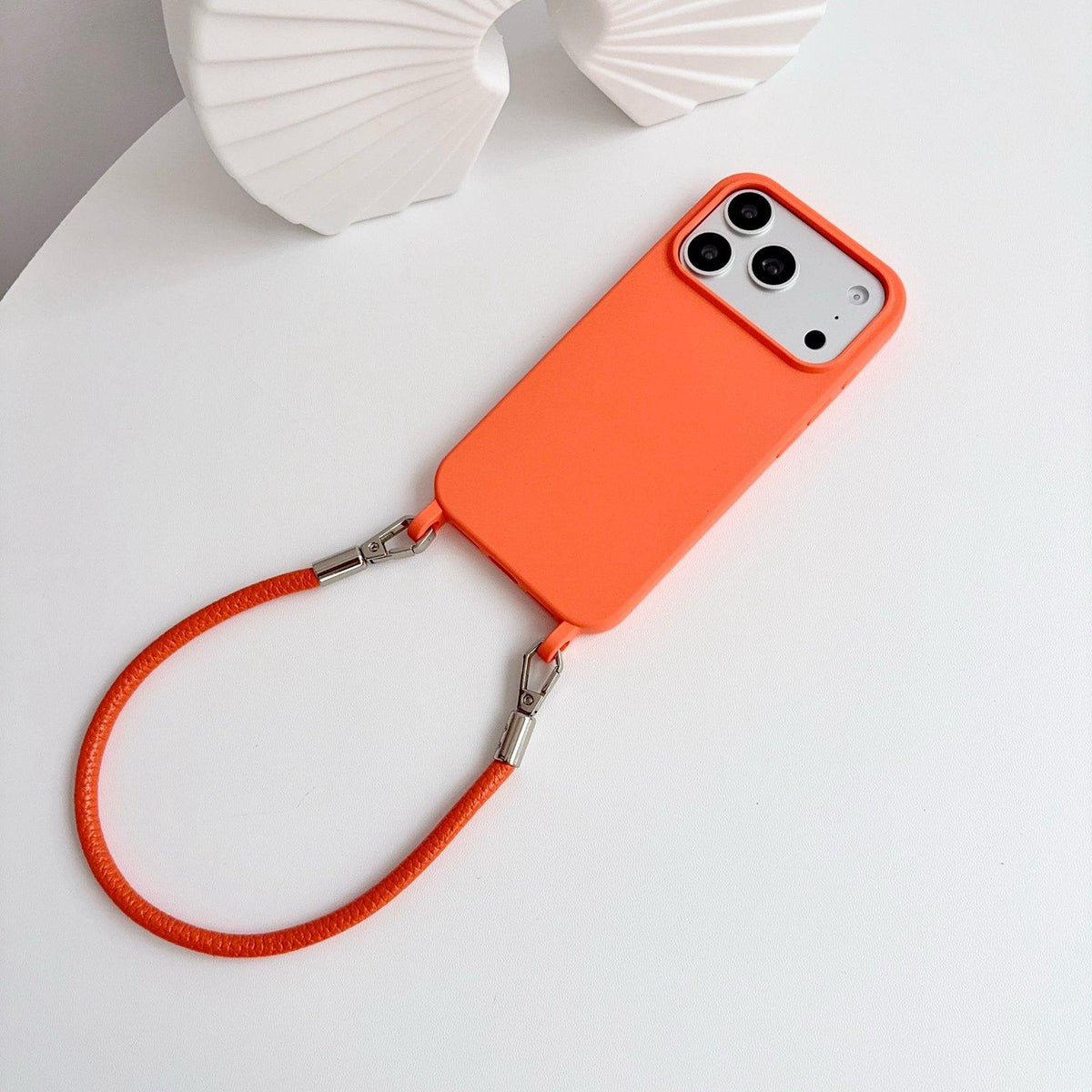 For iPhone 17 Integrated Lanyard Loops Shockproof Silicone Phone Case with Leather Hand Lanyard - Orange - EDA009745903R