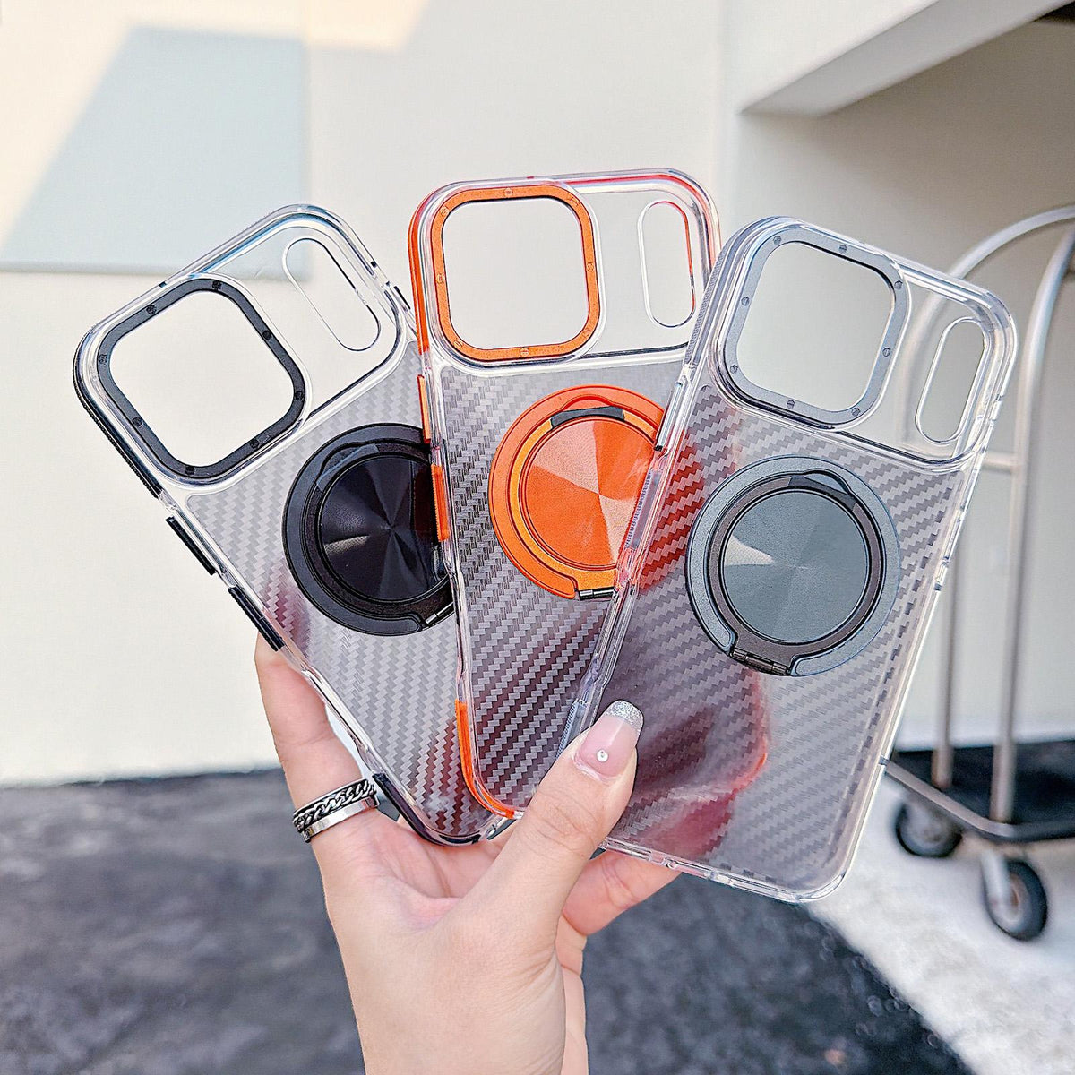 For iPhone 17 Pro Max Dual-Color Carbon Fiber Texture Rotation Holder Magnetic Phone Case - Orange - EDA009807901A