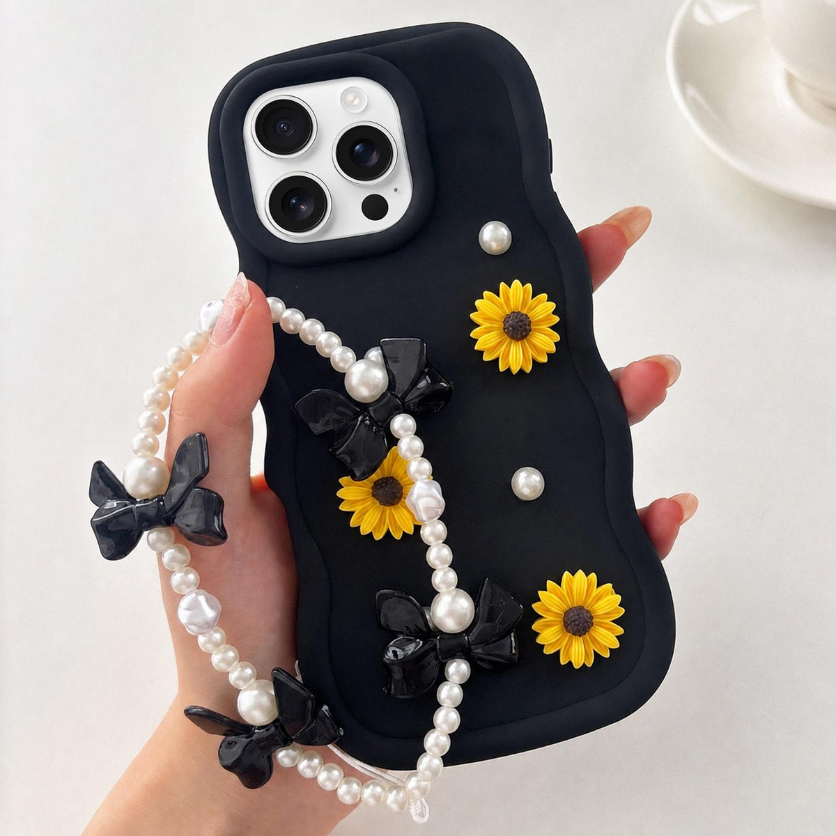 For iPhone 16 Pro Macaron Color Little Daisy and Pearl Phone Case with Bracelet Chain - Black - EDA010167109C