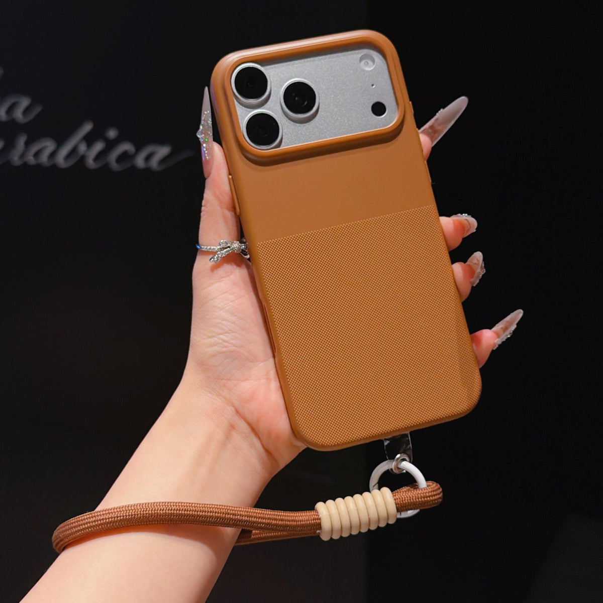 For iPhone 17 Pro Imitation Dot-texture TPU Phone Case with Strap - Brown - SYA003421002D