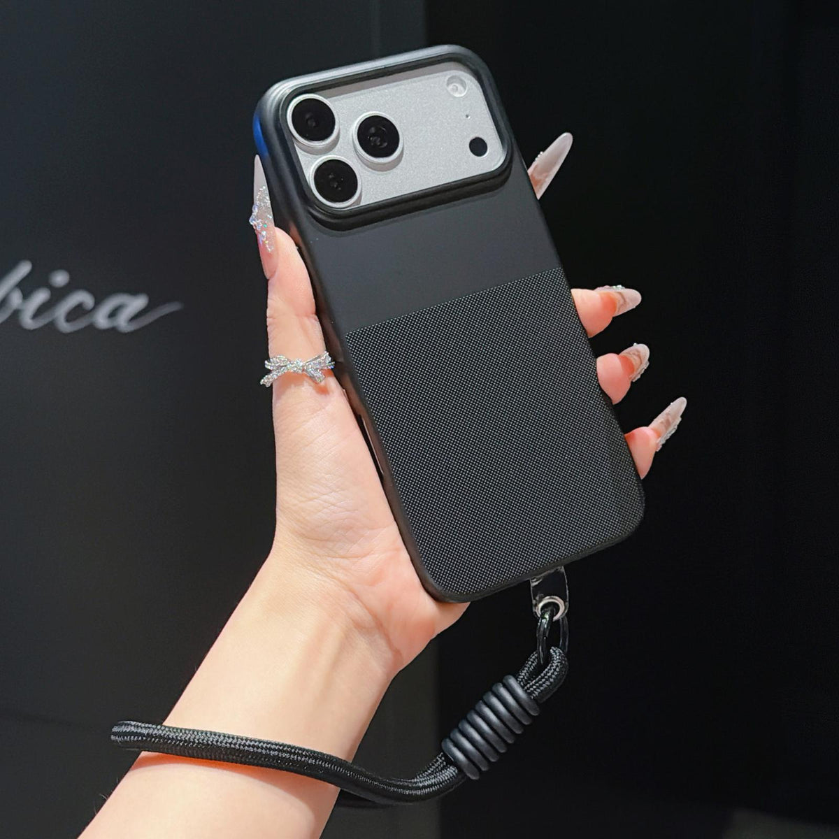 For iPhone 17 Pro Imitation Dot-texture TPU Phone Case with Strap - Black - SYA003421002E